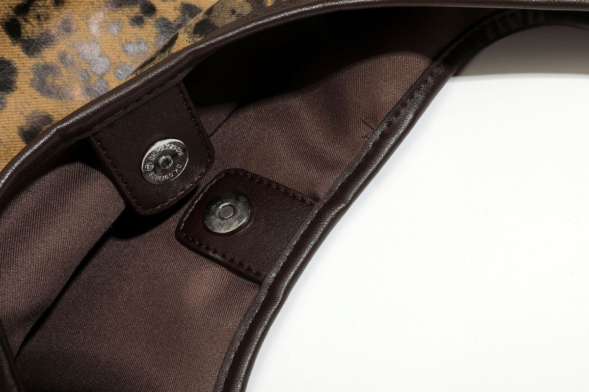 Large slouchy leopard-print shoulder tote bag with glossy tan-and-brown finish, dark brown leather-look trim, single