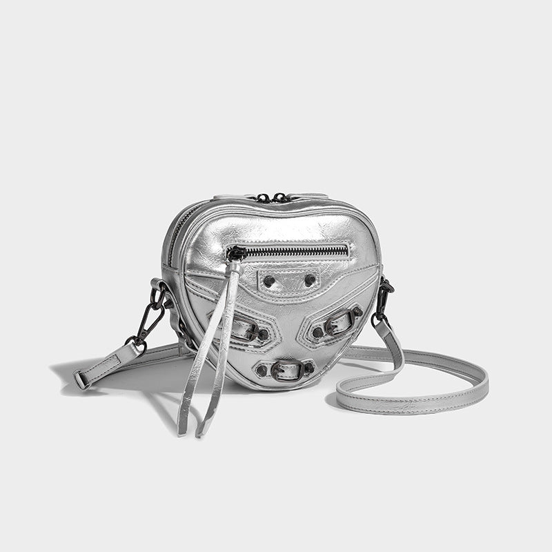 Mini heart-shaped crossbody bag with glossy crinkled finish and moto buckle hardware, detail view 29