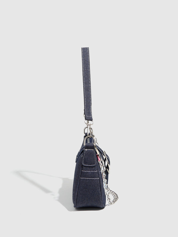 Dark navy denim-look shoulder bag with light blue and pink star appliqués, silver-tone buckle, chain strap, and short top