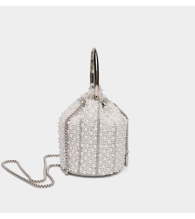 Small pearl-beaded drawstring bucket bag with silver-tone ring top handle and chain shoulder strap, detail view 12
