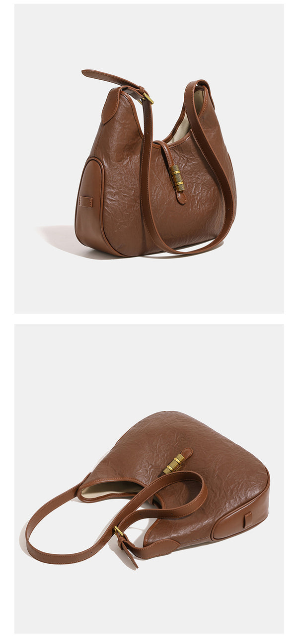 Schmal zulaufende, weich fallende Schultertasche aus geknitterter Lederoptik mit goldfarbenem Riegelverschluss und verstellbarem Schulterriemen, Detailansicht 8
