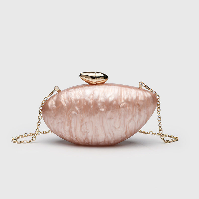Oval hard-shell marbled gloss clutch bag with gold-tone kiss-lock clasp and detachable gold chain strap, detail view 8