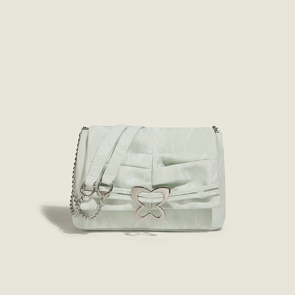 Structured rectangular chain shoulder bag with silver butterfly clasp and glossy crinkled finish, detail view 6