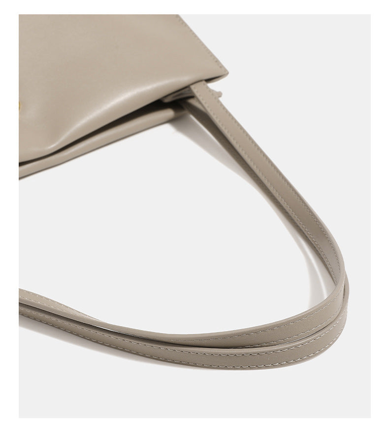 Smooth leather-look slouchy trapezoid shoulder tote with gold-tone gourd clasp hardware and long slim straps, detail view 11