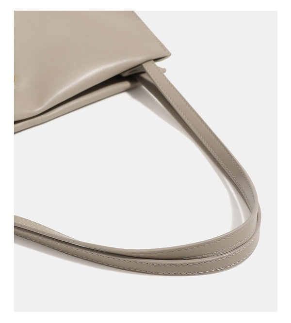 Smooth leather-look slouchy trapezoid shoulder tote with gold-tone gourd clasp hardware and long slim straps, detail view 11