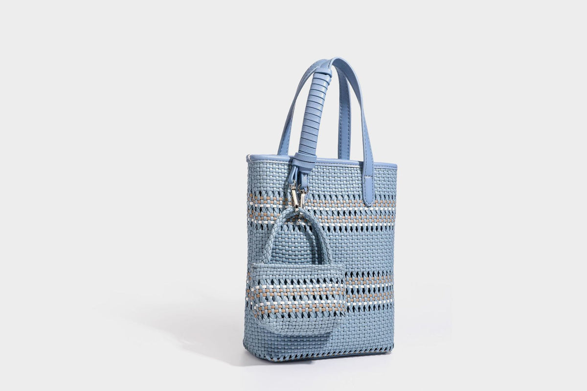 Kleine, formstabile Korb-Shopper-Tasche aus geflochtenem Material mit umwickelten Griffen in Lederoptik und silberfarbenen Verschlussbeschlägen, Detailansicht 38