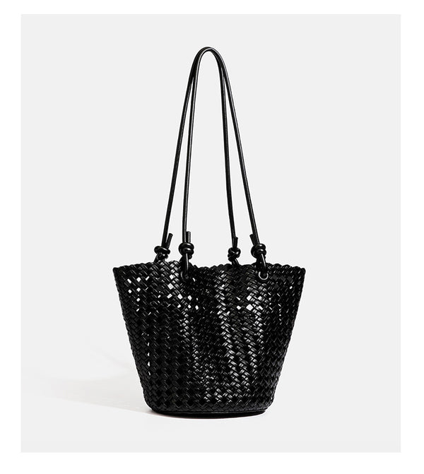 Open-weave lattice bucket tote bag with long knotted cord handles and tapered silhouette, detail view 19