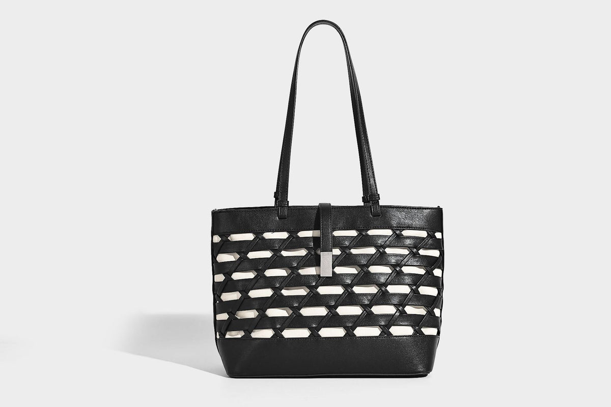 Structured woven lattice cutout tote bag with smooth leather-look trim, dual shoulder straps, and silver-tone hardware