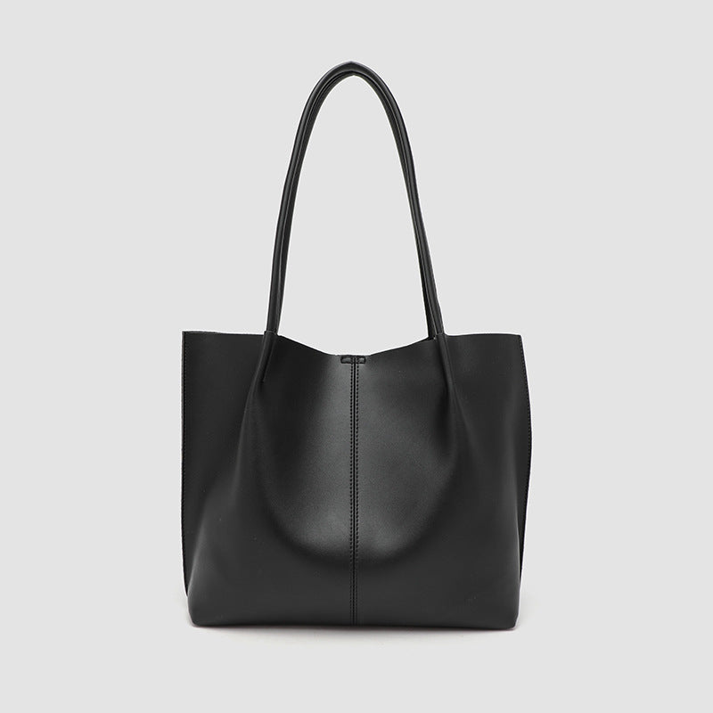 Large slouchy matte leather-look tote bag with double shoulder straps and centre seam detail, front view