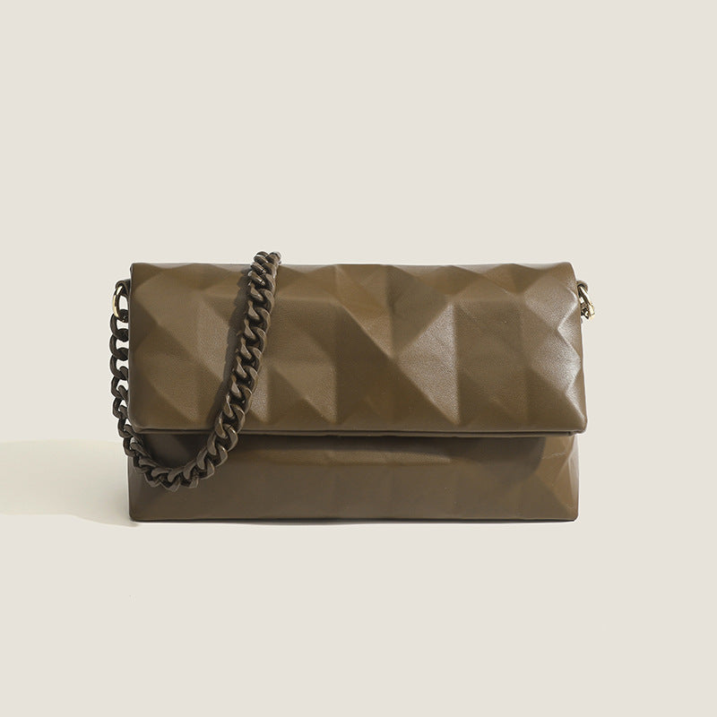 Cream white rectangular flap shoulder bag with geometric faceted surface and chunky tone-on-tone chain strap with gold-tone