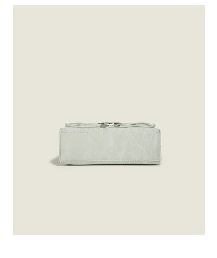 Structured rectangular chain shoulder bag with silver butterfly clasp and glossy crinkled finish, detail view 14