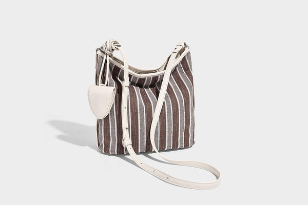 Large striped canvas hobo shoulder bag with cream trim and silver-tone hardware, detail view 22