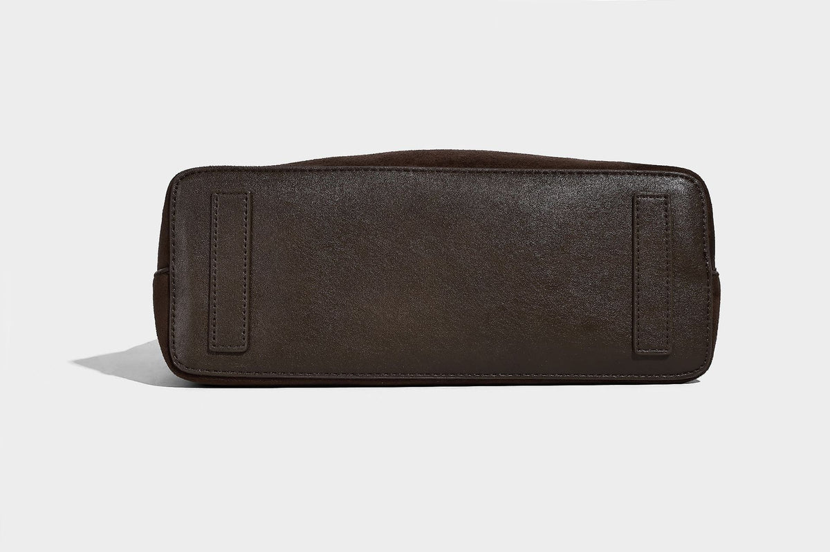 Dark brown suede-look hobo shoulder bag with top zip closure, adjustable strap, and small detachable mini pouch, detail view