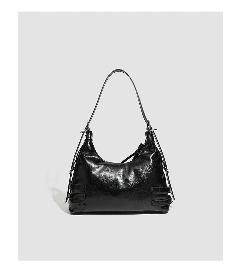 Slouchy hobo shoulder bag in glossy crinkled leather-look finish with silver-tone buckle hardware and slim adjustable strap