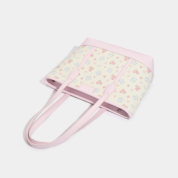 Große, strukturierte Tote-Bag mit Reißverschluss oben, Einsätzen mit pastellfarbenem Cartoon-Print, glattem Besatz in rosafarbener Lederoptik und zwei Schulterriemen