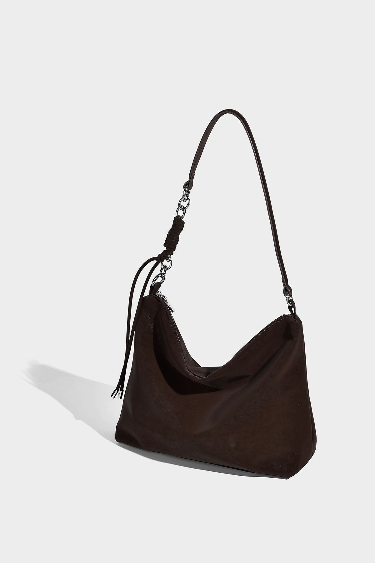 Slouchy matte-finish hobo shoulder bag with tassel cords, silver-tone hardware, and faux-fur pom charm, detail view 14