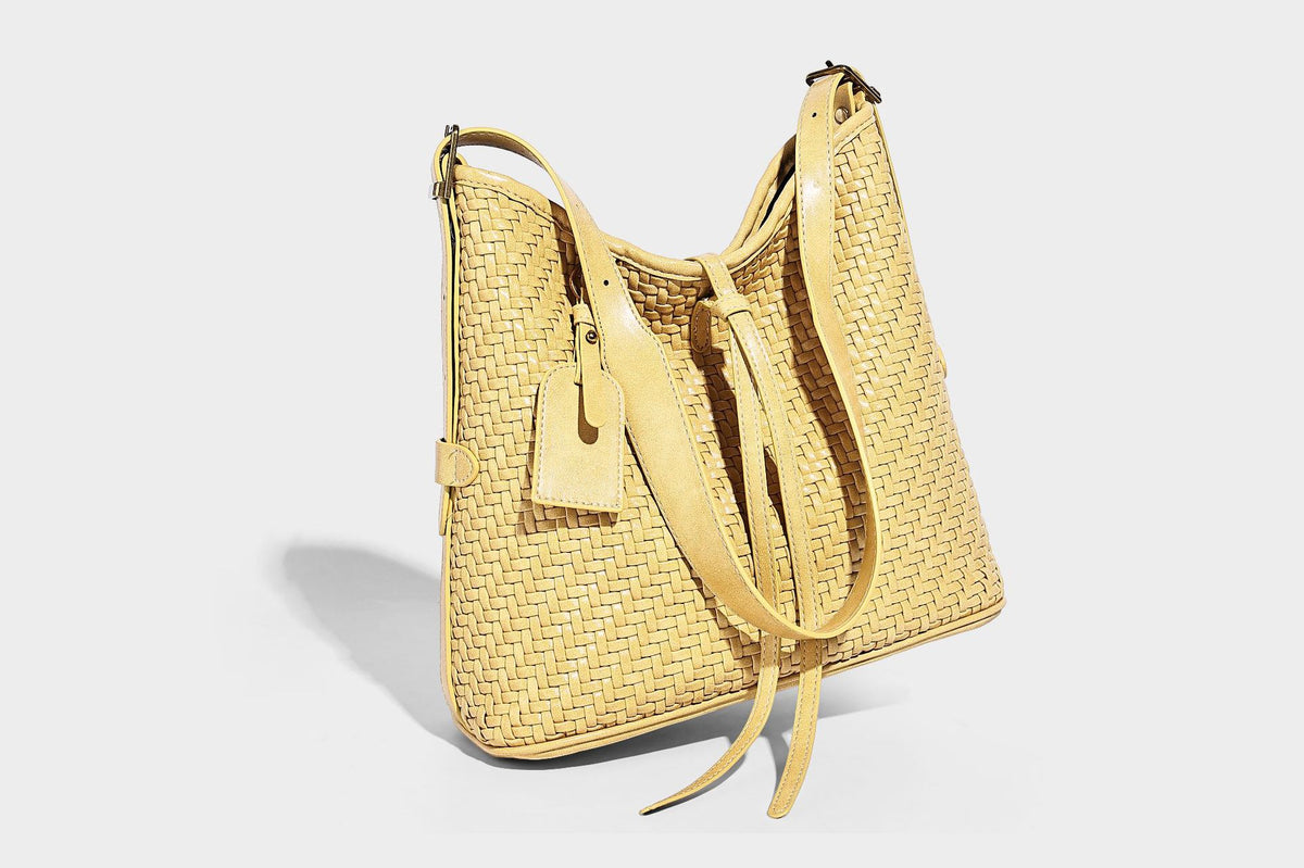 Slouchy woven-texture bucket shoulder bag with tassel tie closure and gold-tone hardware, detail view 26
