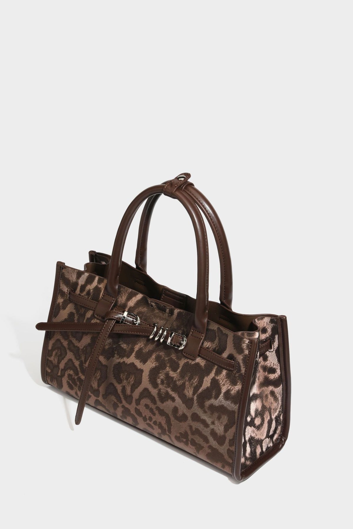 Structured leopard-print tote bag with glossy satin-like finish, dual rounded top handles, silver buckle-and-ring front