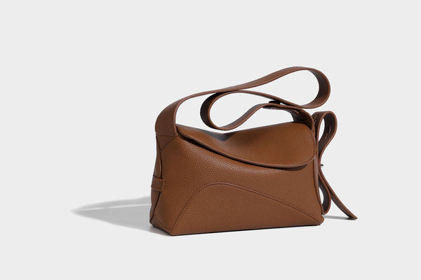 Structured curved-flap pebbled PU shoulder bag with sculptural loop strap detail, detail view 6