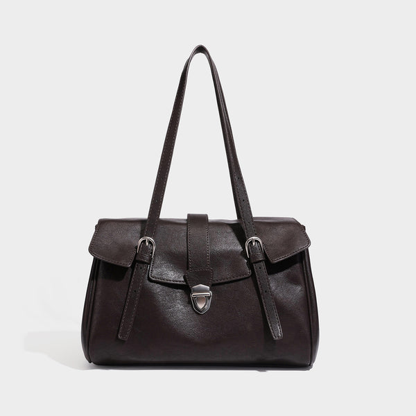 Large structured vintage-style tote bag with flap-front turn-lock closure, twin buckle straps, and double shoulder handles