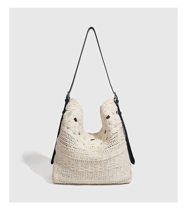Cream woven rope-cord hobo bag with black adjustable leather-look strap and matching cream drawstring pouch, detail view 11