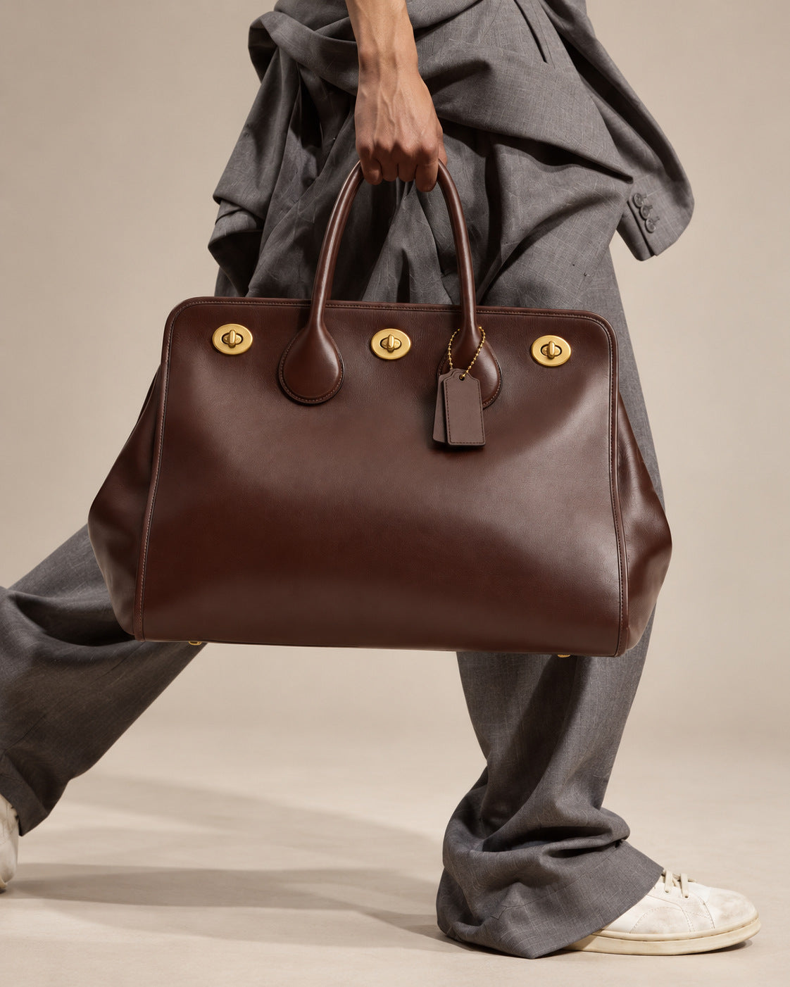 Structured leather-look tote bag with three gold-tone turn-lock closures and double rolled top handles, detail view 10