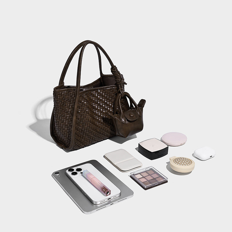 Woven texture open-top tote bag with smooth trim top handles and attached mini drawstring pouch in dark brown, detail view 4