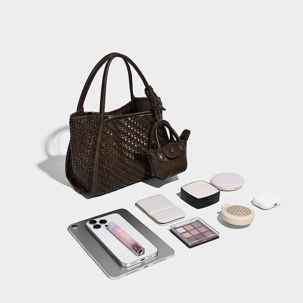 Woven texture open-top tote bag with smooth trim top handles and attached mini drawstring pouch in dark brown, detail view 4