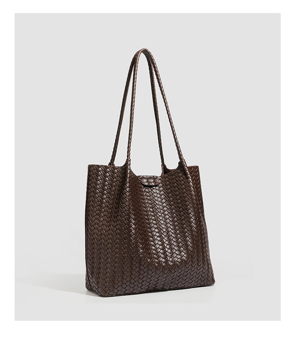 Large black basket-weave leather-look tote bag with long braided shoulder straps and matching woven zip pouch, detail view 20