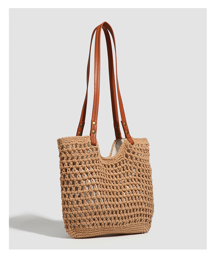 Open-knit woven tote bag with leather-look shoulder straps and brass-tone hardware in off-white, detail view 13
