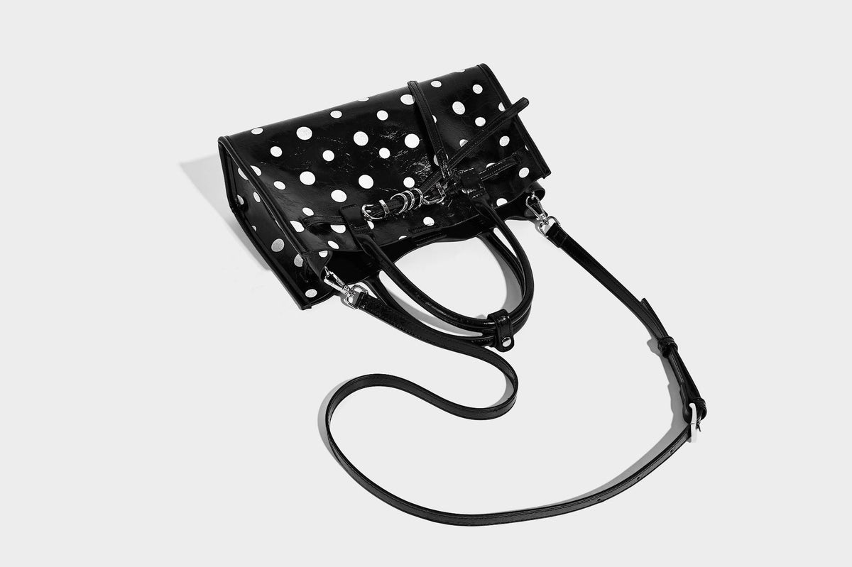 Structured glossy leather-look polka-dot satchel tote with dual top handles and detachable shoulder strap, detail view 21