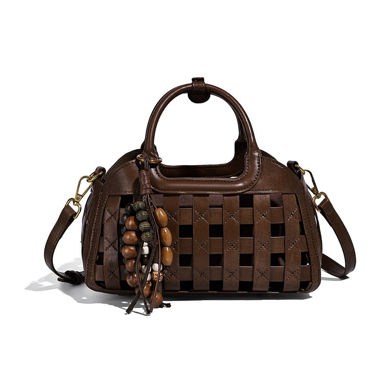 Small structured woven lattice top-handle satchel bag with bead-and-tassel charm and gold-tone hardware, detail view 5
