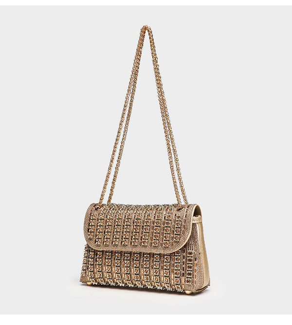 Structured mini flap crossbody bag covered in grid-set rhinestones with silver-tone chain strap, detail view 10