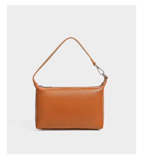 Large cream and navy striped canvas bucket tote bag with tan leather-look trim, drawstring closure, and double shoulder