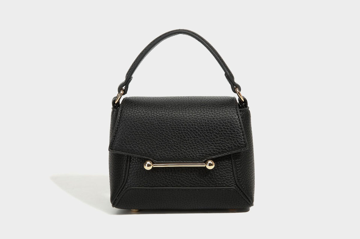 Small structured pebbled flap mini satchel with gold-tone bar hardware, short top handle, and detachable crossbody strap