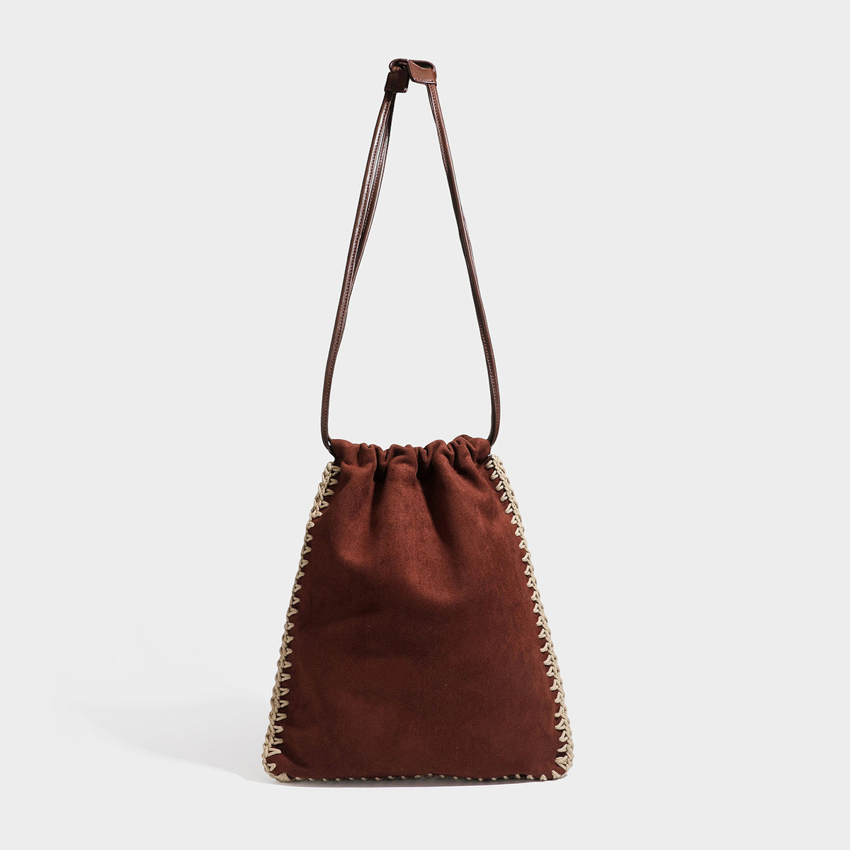 Matte suede-look drawstring bucket bag with cream braided woven edge trim and slim adjustable leather-look shoulder strap
