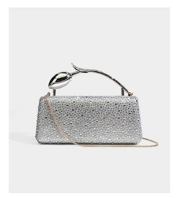 rectangular hard-case rhinestone evening clutch with sculptural gold-tone branch-and-bud top handle and detachable chain