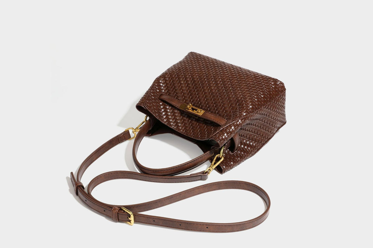 Structured woven leather-look bucket bag with gold-tone turn-lock hardware and detachable shoulder strap, detail view 40