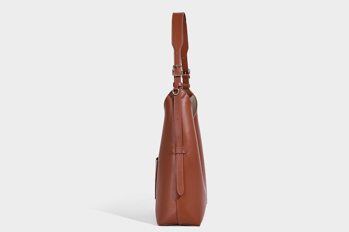 Large open-top hobo shoulder bag in tan leather-look finish with detachable zip pouch and adjustable buckle strap, detail