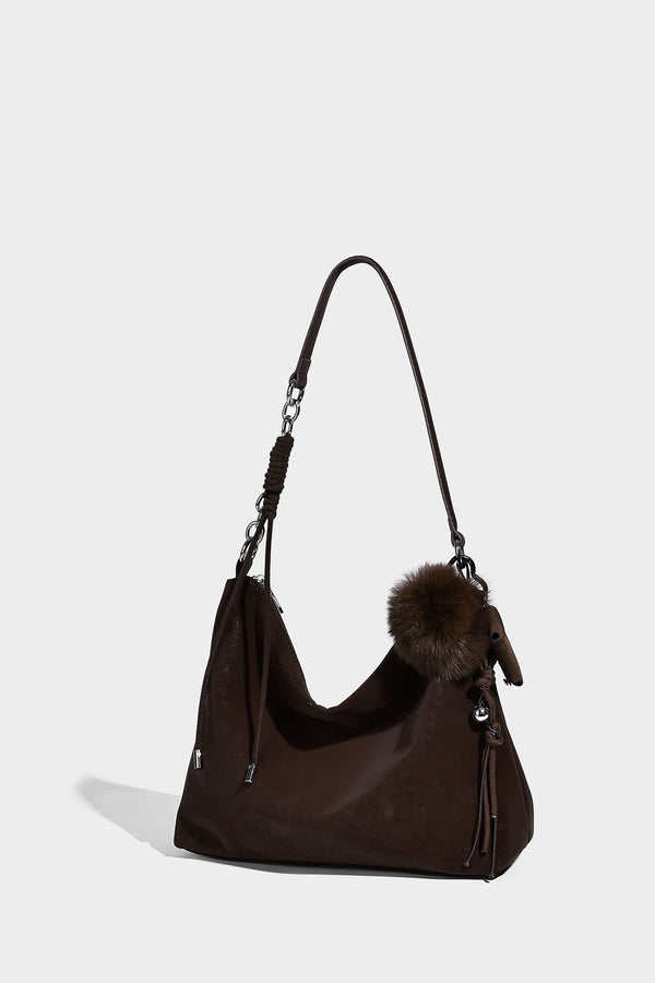 Slouchy matte-finish hobo shoulder bag with tassel cords, silver-tone hardware, and faux-fur pom charm, detail view 26