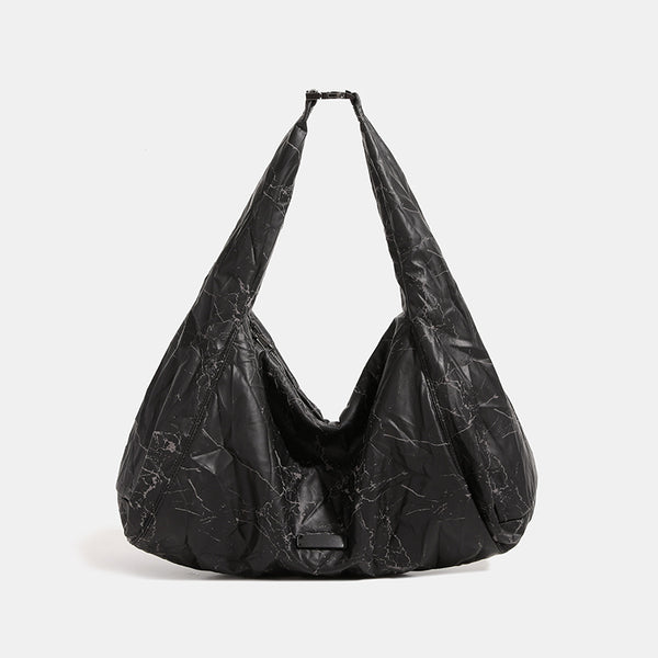 Oversized slouchy hobo shoulder bag in dark marled denim-texture fabric with top zip closure and adjustable single strap
