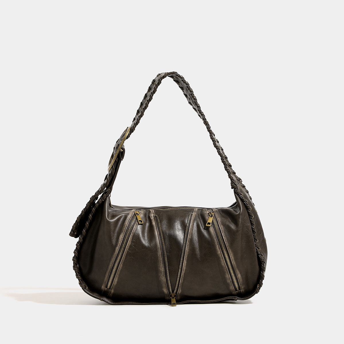 Slouchy hobo shoulder bag with wide braided eyelet strap, multiple front zip compartments, and silver-tone ring buckle