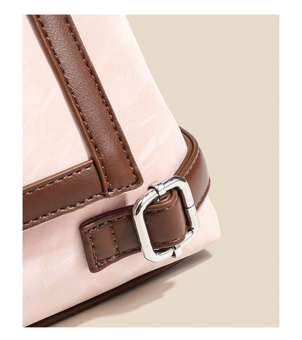 Structured crinkle-finish flap shoulder bag with butterfly metal appliqué and dark brown contrast trim, detail view 14