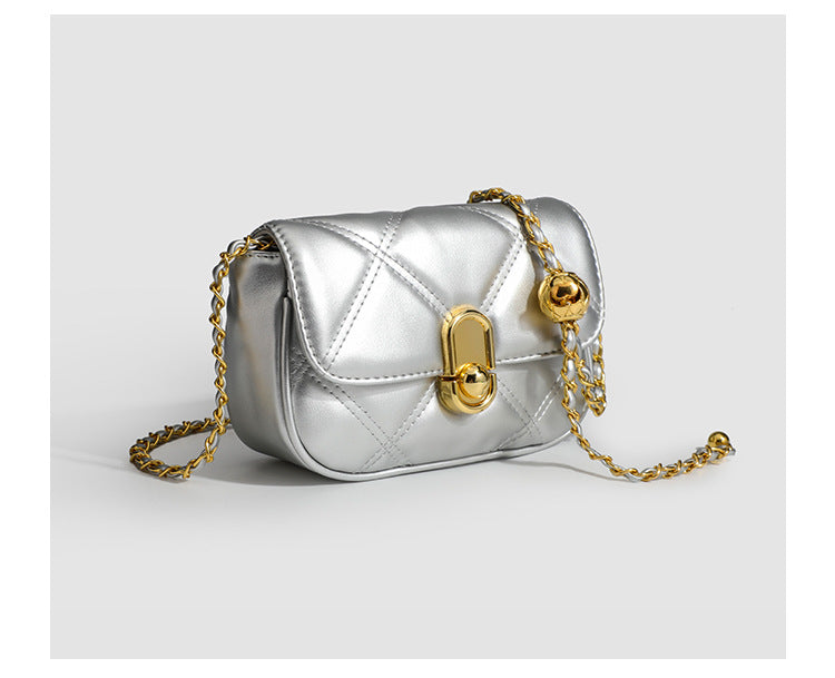 Compact diamond-quilted mini crossbody bag with gold-tone turn-lock closure and woven chain strap, detail view 17