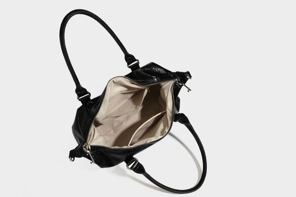 Glossy crinkled barrel handbag with silver stud buckle strap and detachable shoulder strap, detail view 38