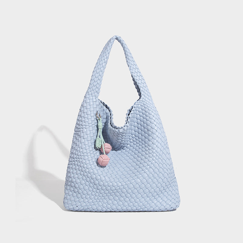 Soft hand-woven slouchy hobo tote bag with knotted tassel charm and single looped shoulder strap, detail view 17