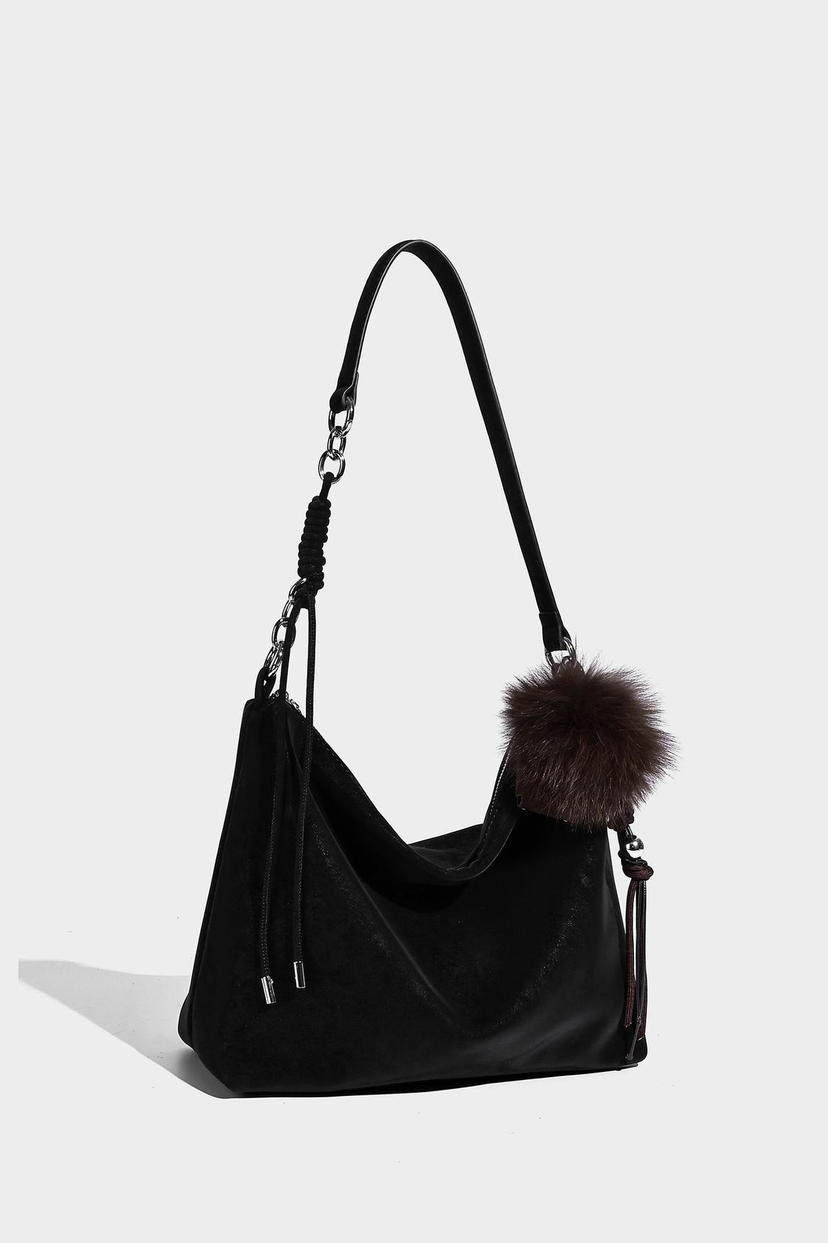Slouchy matte-finish hobo shoulder bag with tassel cords, silver-tone hardware, and faux-fur pom charm, detail view 33