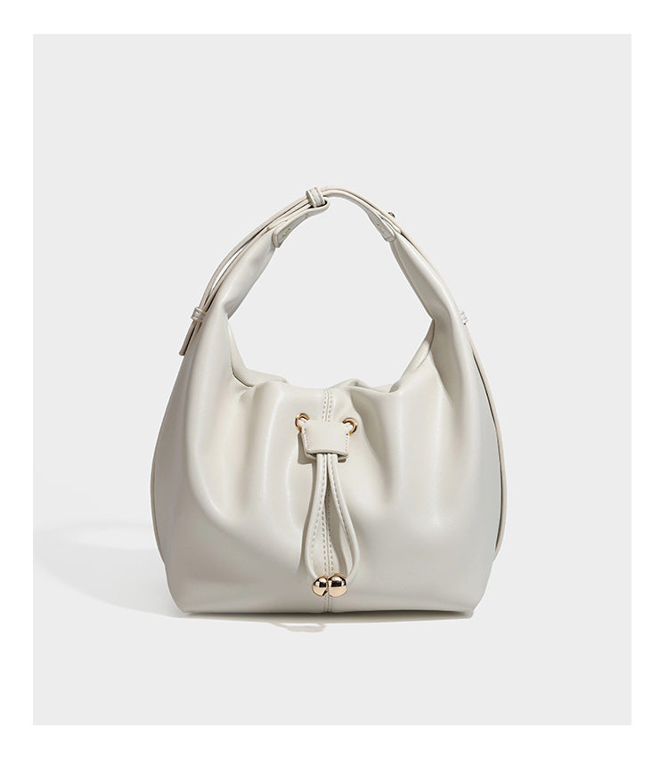 Slouchy hobo bag with smooth leather-look finish, drawstring cinch closure, and gold-tone bead hardware, detail view 17