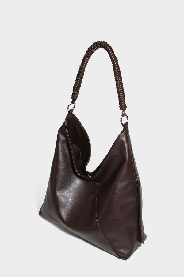 Large slouchy hobo shoulder bag with braided top handle, smooth glossy leather-look finish, and silver-tone ring hardware