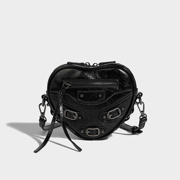 Mini heart-shaped crossbody bag with glossy crinkled finish and moto buckle hardware, detail view 6